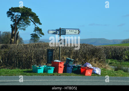 Household waste and recycling by the side of the road in Powys, Wales Stock Photo