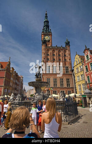 Tourists at Neptune Fountain, Dlugi Targ (Long Market) in Gdansk, Pomerania, Poland Stock Photo