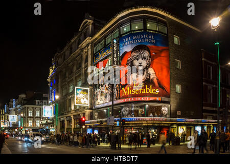 London's West End at night with Les Miserables at Queens Theatre in Shaftesbury Avenue.