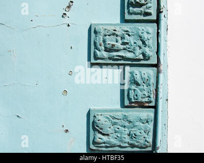 A wall with cracks and texture and painted brick detail. Stock Photo