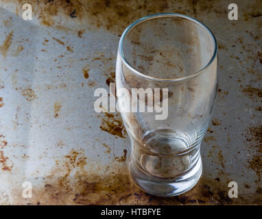 empty beer glass on a steel plate Stock Photo