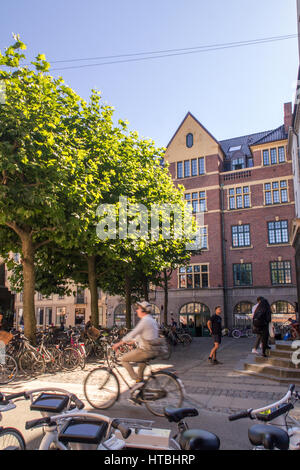COPENHAGEN, DENMARK - SEPTEMBER 5: Latin Quarter in Copenhagen, Denmark. Old scandinavian houses, restaurants, parked bicycles and university building Stock Photo