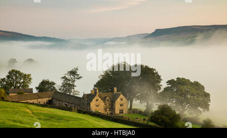 Offerton Hall above the mist in the Derwent Valley below, Derbyshire Peaks District, England, UK Stock Photo