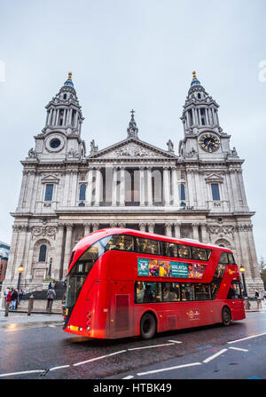 St Paul's Cathedral with double decker bus driving past. London, UK.