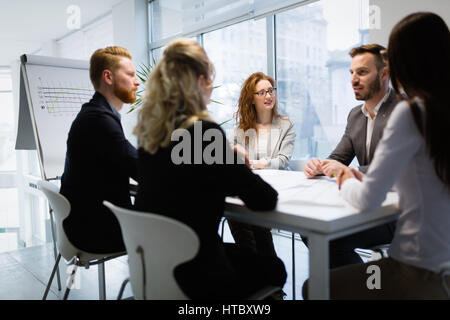 Colleagues attending seminars and business meetings in company office Stock Photo
