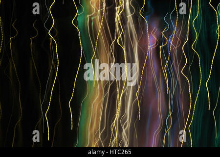 neon light trail abstract photograph in multiple colors on black background Stock Photo