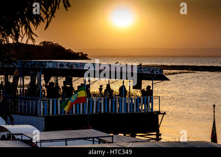 Ethiopian People Dining At A Lakeside Restaurant At Sunset, Lake Awassa, Ethiopia Stock Photo