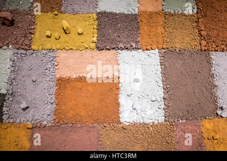 Texture of different colors of dry clay with stones Stock Photo