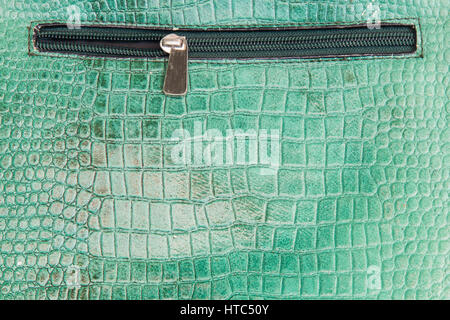 Crocodile leather texture with zipper. Stock Photo