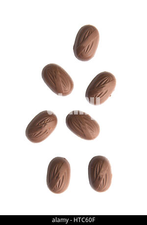Falling chocolate with almonds on white background. Stock Photo
