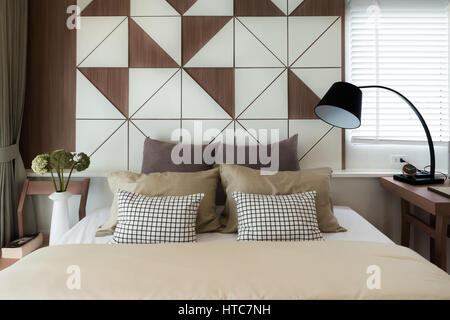Interior of luxury bedroom in house or hotel with lamp. Interior bedroom concept. Stock Photo