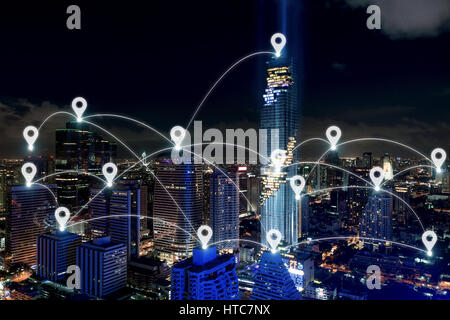 Map pin at smart city and wireless communication network, business district with office building, abstract image visual, internet of things concept Stock Photo