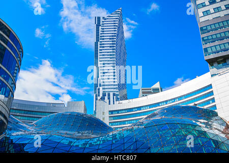 Roof of the Zlote Tarasy shopping mall and the Zlota 44 residential skyscraper in the background in downtown Warsaw, Poland. Stock Photo