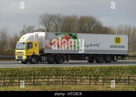 Distribution & transportation - an articulated lorry, heavy goods vehicle (HGV) with Morrisons logo, travelling on the A1 motorway - England, GB, UK. Stock Photo