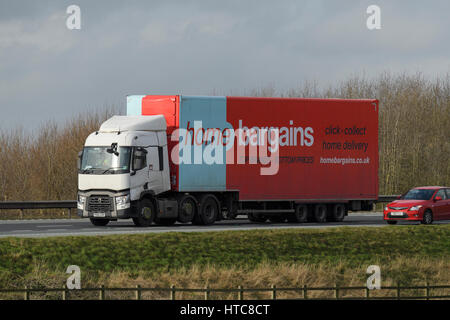 Distribution & transportation - articulated lorry, heavy goods vehicle (HGV) with Home Bargains logo travelling on the A1 motorway - England, GB, UK. Stock Photo