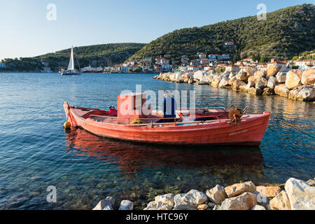 An old fisherman works in his traditional wooden boat in October 14, 2016 in Agia Kiriaki village in Greece. Fishing in wooden traditional boats remai Stock Photo