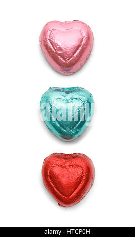 Three Chocolate Hearts in Foil Isolated on White Background. Stock Photo
