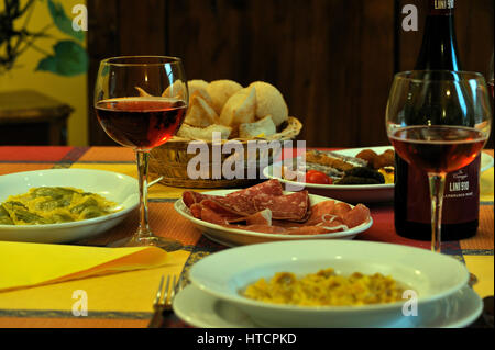 Italian food on italian restaurant table Stock Photo