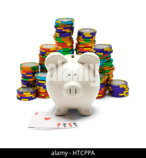 Piggy Bank with Four Aces and Poker Chips Isolated on White. Stock Photo
