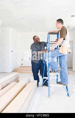 Two builders talking Stock Photo