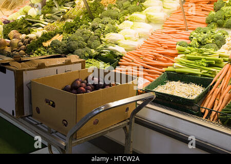 Vegetables on a supermarket shelf Stock Photo