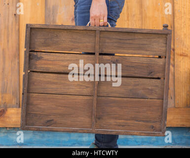 Female hand holding old suitcase, (retro style) Stock Photo