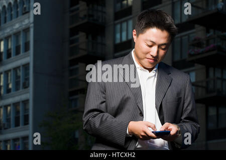 Man using handheld computer Stock Photo