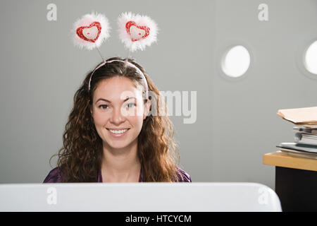 Office worker wearing deely bopper Stock Photo - Alamy