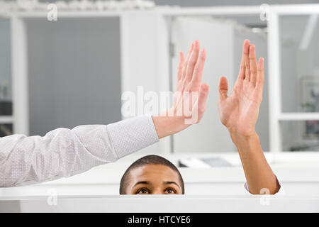 Colleagues doing high five Stock Photo