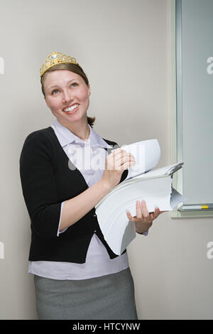 Office worker wearing a tiara Stock Photo