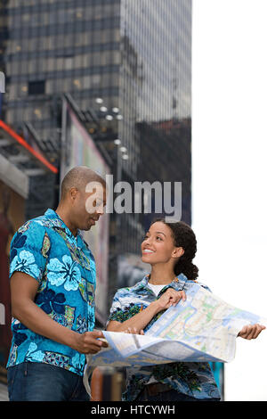 Couple reading map Stock Photo