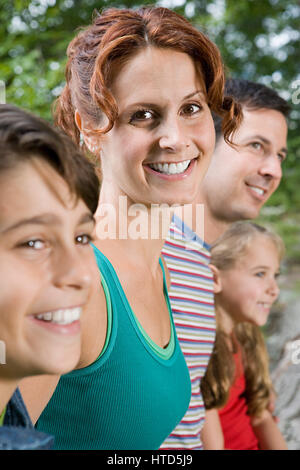 Joyful family camping in the park during the summer Stock Photo - Alamy