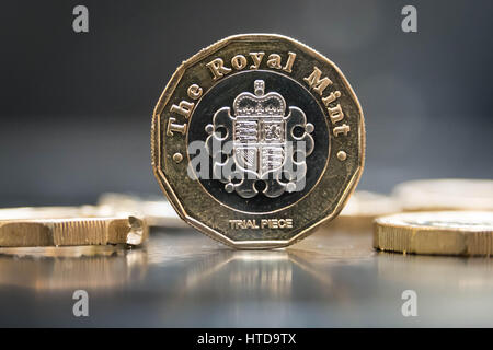 London, UK. 9th Mar, 2017. New £1 coins tested in the London Assay office ahead of their release 28th March, 2017. Pictured: These new coins are supposed to be the most secure and hi-tech coin developed. 12 sides, bi-metallic, hologram, micro-lettering, milled edges are all part of the security features. On top of this the coins have one extra secret component. That's not a problem for Chris, 'They wouldn't tell me what the unidentified marker is- if it's an element, I'll find it.' Credit: Guy Corbishley/Alamy Live News Stock Photo