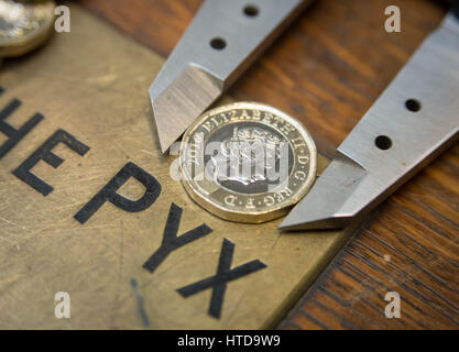 London, UK. 9th Mar, 2017. New £1 coins tested in the London Assay office ahead of their release 28th March, 2017. Pictured: In the Assay office, new £1 coins on the Pyx box, awaiting their trial. The Coins are the Realm are tested by diameter, weight and composition. Credit: Guy Corbishley/Alamy Live News Stock Photo