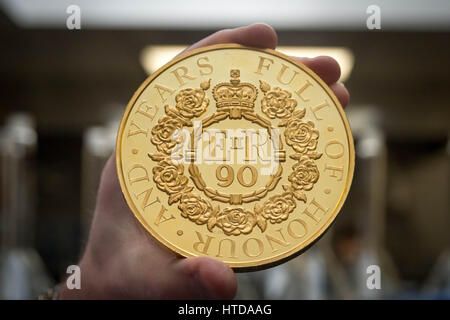 London, UK. 9th Mar, 2017. As well as standard 20p, 50p, £1, and £2 coins, the London Assay office also tests commemorative coins. Pictured here a Gold Proof Kilo Coin with a retail value over £45,000 Credit: Guy Corbishley/Alamy Live News Stock Photo