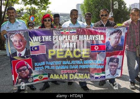 Kuala Lumpur, Malaysia. 10th Mar, 2017. Malaysian activists hold the 'peace' placard outside the North Korean Embassy in Kuala Lumpur, Malaysia on March 10, 2017. Malaysia said on March 07 that North Korea embassy staff are barred from leaving the country, after Pyongyang, North Korea banned all Malaysian citizens from leaving. Credit: Chris Jung/ZUMA Wire/Alamy Live News Stock Photo