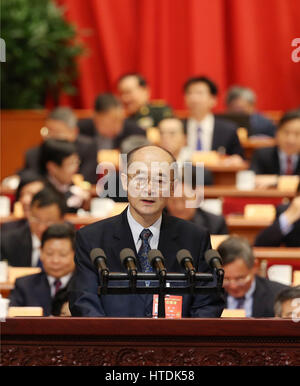 Beijing, China. 11th Mar, 2017. On behalf of the Liaison with Hong Kong, Macao, Taiwan and Overseas Chinese Committee of the Chinese People's Political Consultative Conference (CPPCC) National Committee and the All-China Federation of Returned Overseas Chinese, Zhao Yang, a member of the 12th National Committee of the CPPCC, delivers a speech at the fourth plenary meeting of the fifth session of the 12th CPPCC National Committee in the Great Hall of the People in Beijing, capital of China, March 11, 2017. Credit: Yao Dawei/Xinhua/Alamy Live News Stock Photo