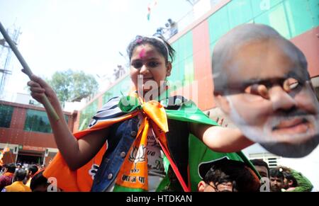 Lucknow, Uttar Pradesh, India. 11th Mar, 2017. Lucknow: BJP supporters celebrate their victory in exit poll results of Uttar Pradesh Assembly election at BJP Office in Lucknow on 11-03-2017.  Credit: Prabhat Kumar Verma/ZUMA Wire/Alamy Live News Stock Photo