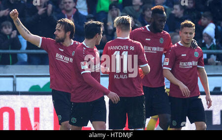 Hanover, Germany. 11th Mar, 2017. Hanover's Martin Harnik (L)celebrates his 1:0 goal against TSV Munich 1860 with Edgar Prib (2nd from L), Felix Klaus (3rd from L), Salif Sane and Sebastian Maeier (R) during the German 2nd division Bundesliga soccer match between Hannover 96 and TSV 1860 Munich in the HDI-Arena in Hanover, Germany, 11 March 2017. (EMBARGO CONDITIONS - ATTENTION: Due to the accreditation guidelines, the DFL only permits the publication and utilisation of up to 15 pictures per match on the internet and in online media during the match.) Photo: Peter Steffen/dpa/Alamy Live News Stock Photo