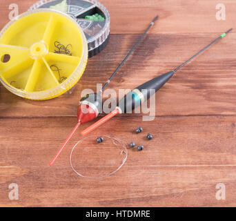 The floats, sinkers, fishing line with hooks and small round box Stock Photo
