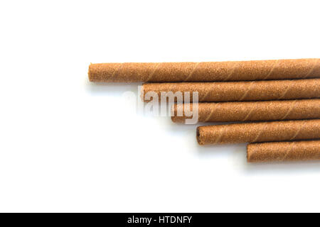 wafer rolls with chocolate isolated on white background. Stock Photo