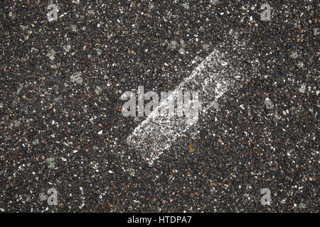 White stripe on grungy dark gray tarmac, highway road marking. Abstract transportation background texture Stock Photo