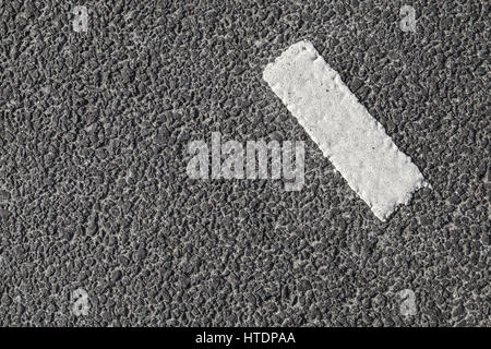 White stripe on dark gray tarmac, highway road marking. Abstract transportation background texture Stock Photo