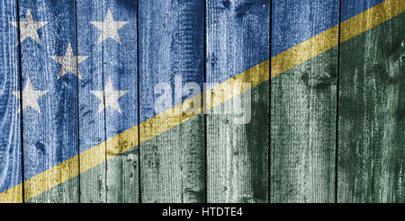 Flag of the Solomon Islands on weathered wood Stock Photo