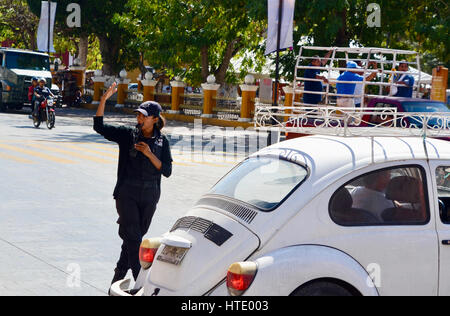 woman police officer directs traffic in valladolid mexico Stock Photo