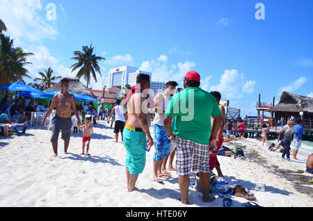 locals on beach in cancun mexico Stock Photo