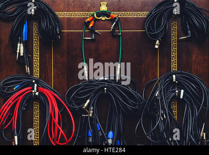 Storage of cables on the wall in the recording studio Stock Photo