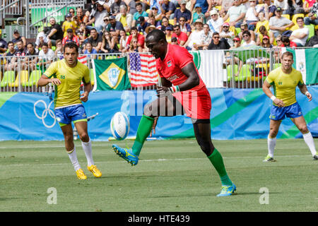 Rugby Sevens action, Collins Injera of Kenya, tackles Gillies Kaka of ...
