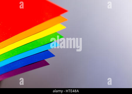 Rainbow colors with papers in brown table Stock Photo