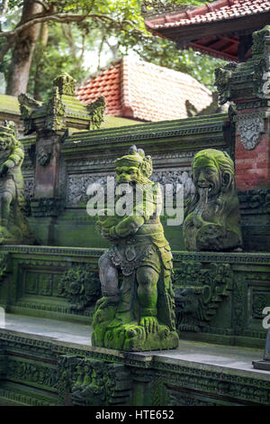 hindu statues on standing on the steps of the temple in the Monkey Forest Sanctuary in Ubud, Bal Stock Photo